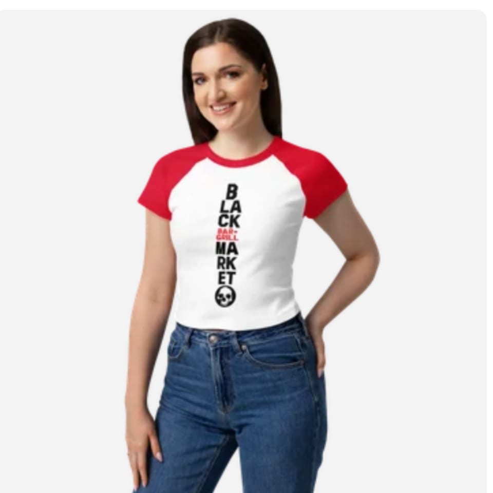 Woman wearing a white and red Black Market Bar & Grill t-shirt with a skull logo.